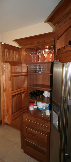 Photograph of an open Kitchen cabinet showing the design of shelves